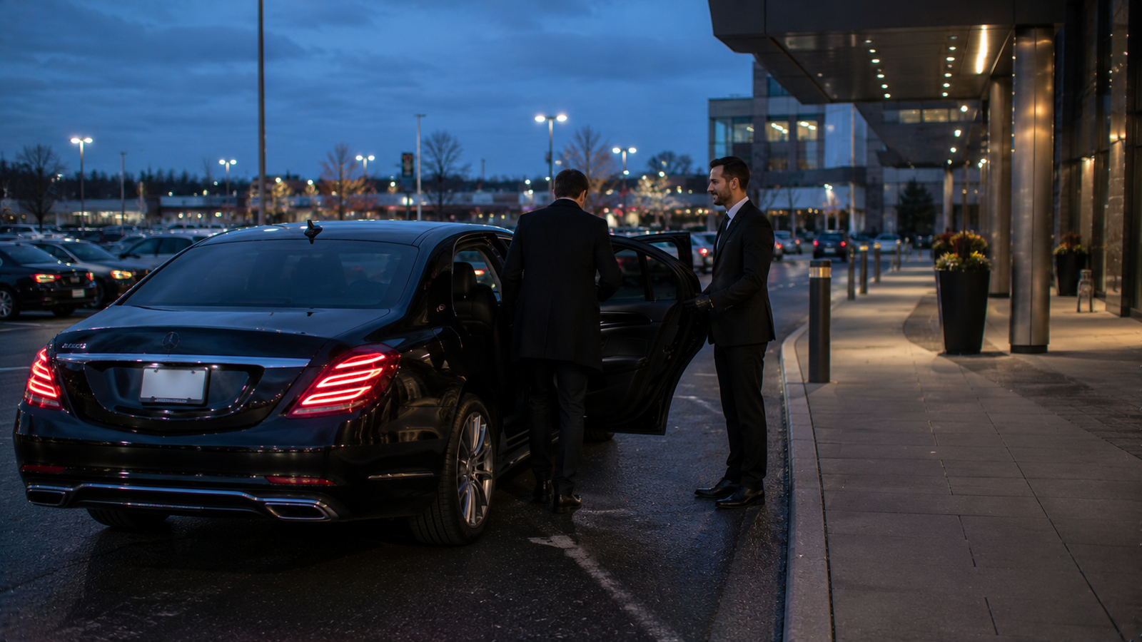 Black limousine parked on a Elmvale, Ontario town street for airport transfer